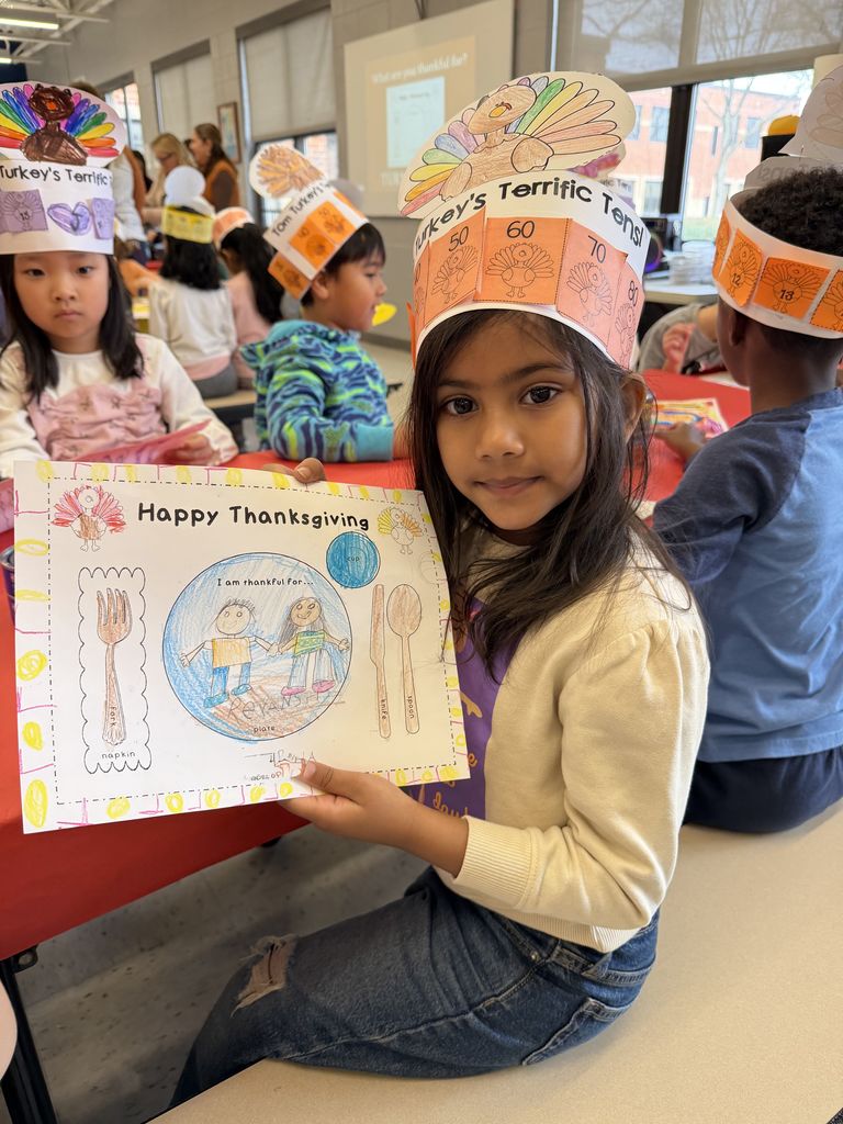 Student showing what she is thankful for.
