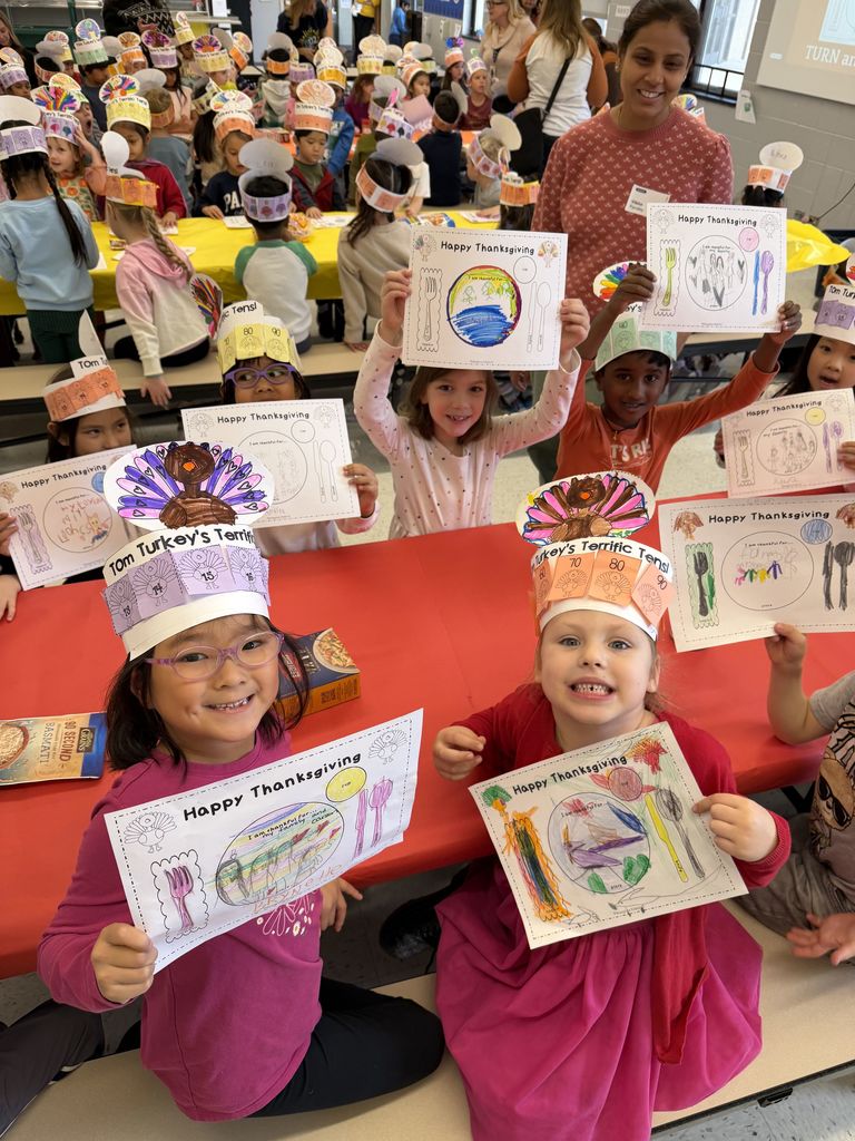 Students holding up a menu about what they are thankful for.