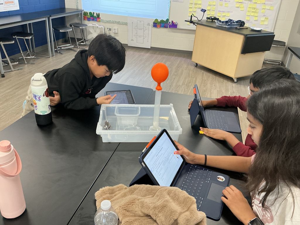 Students working on ipads.