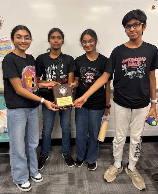 Students holding an award