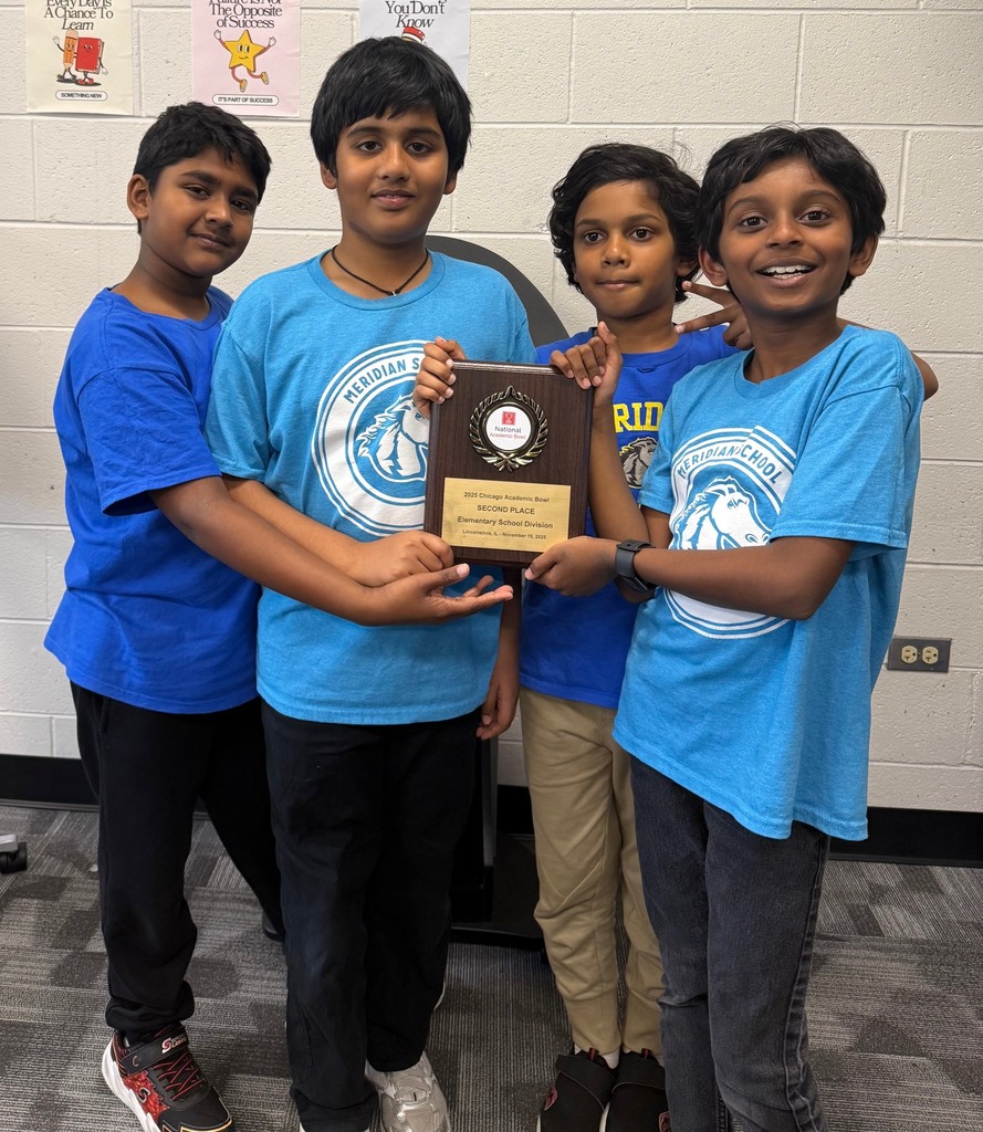 Students holding an award.