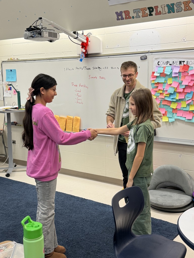 Students making a deal and shaking hands.