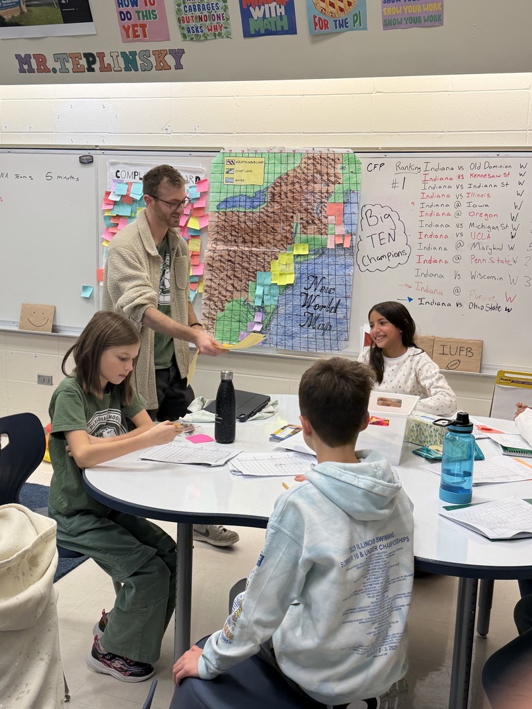 Students working on making a trade.