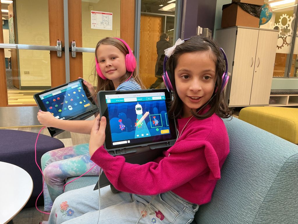 Students smiling with their iPads