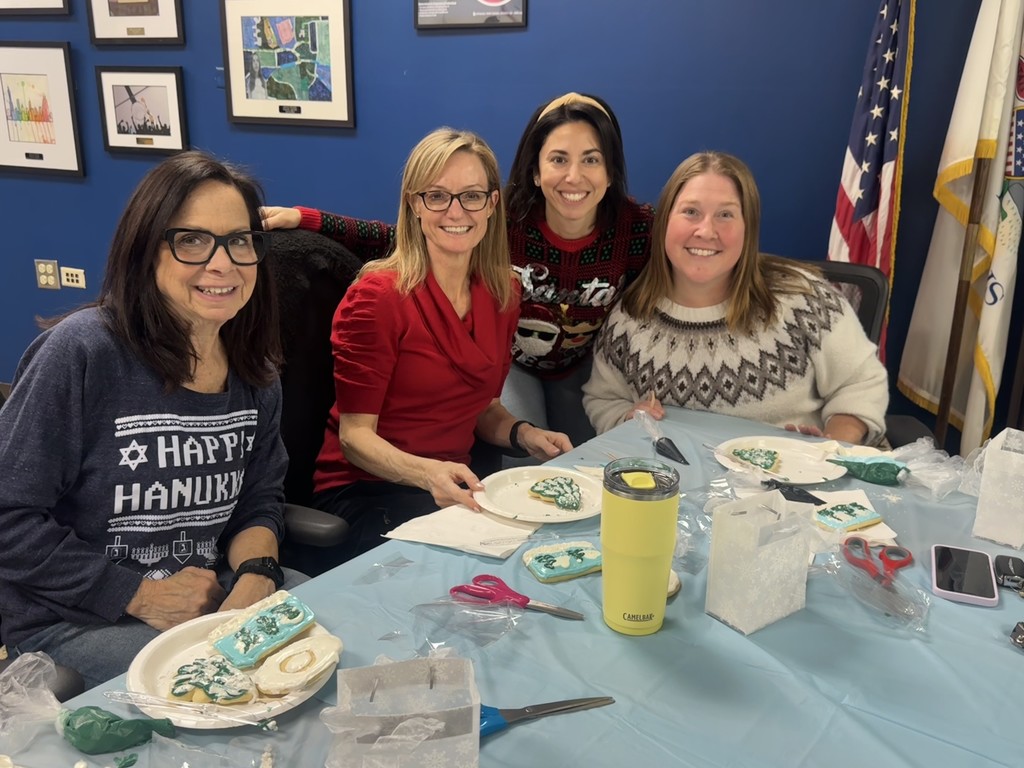 Teachers sitting together with their cookies.