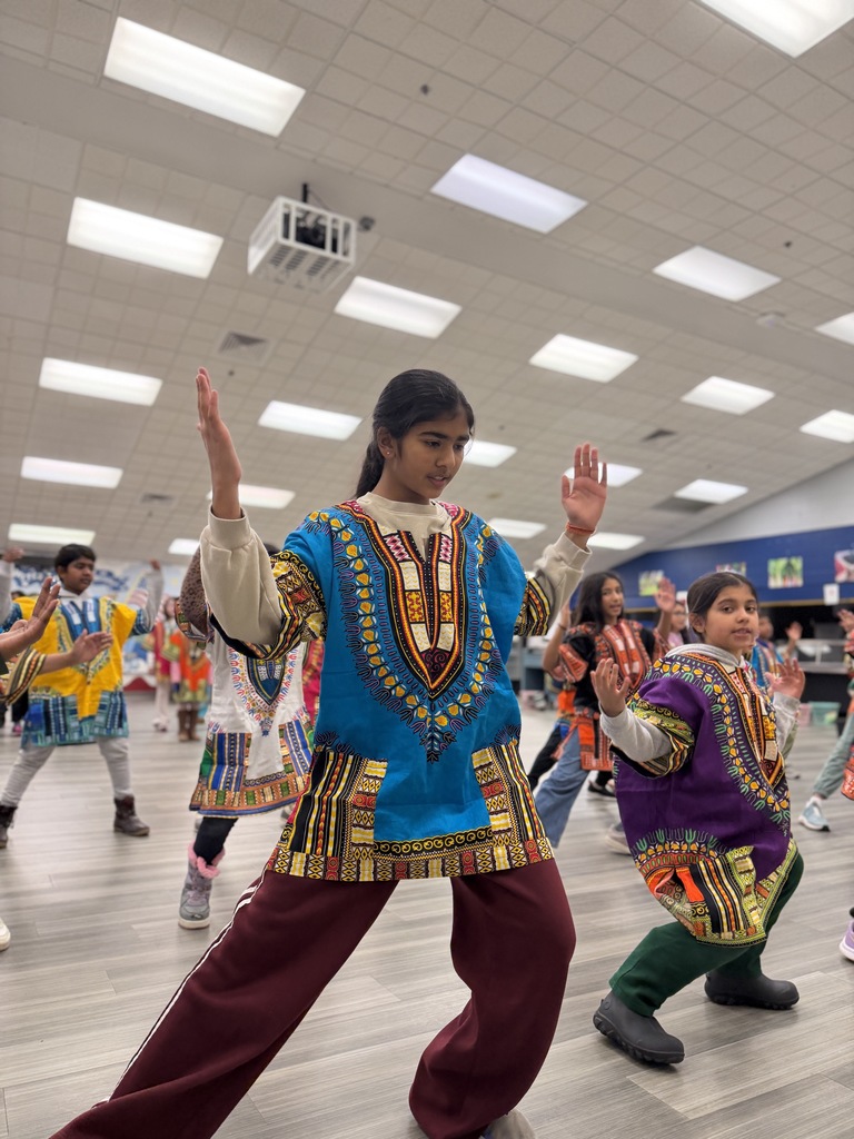 Students dancing and practicing for a musical.
