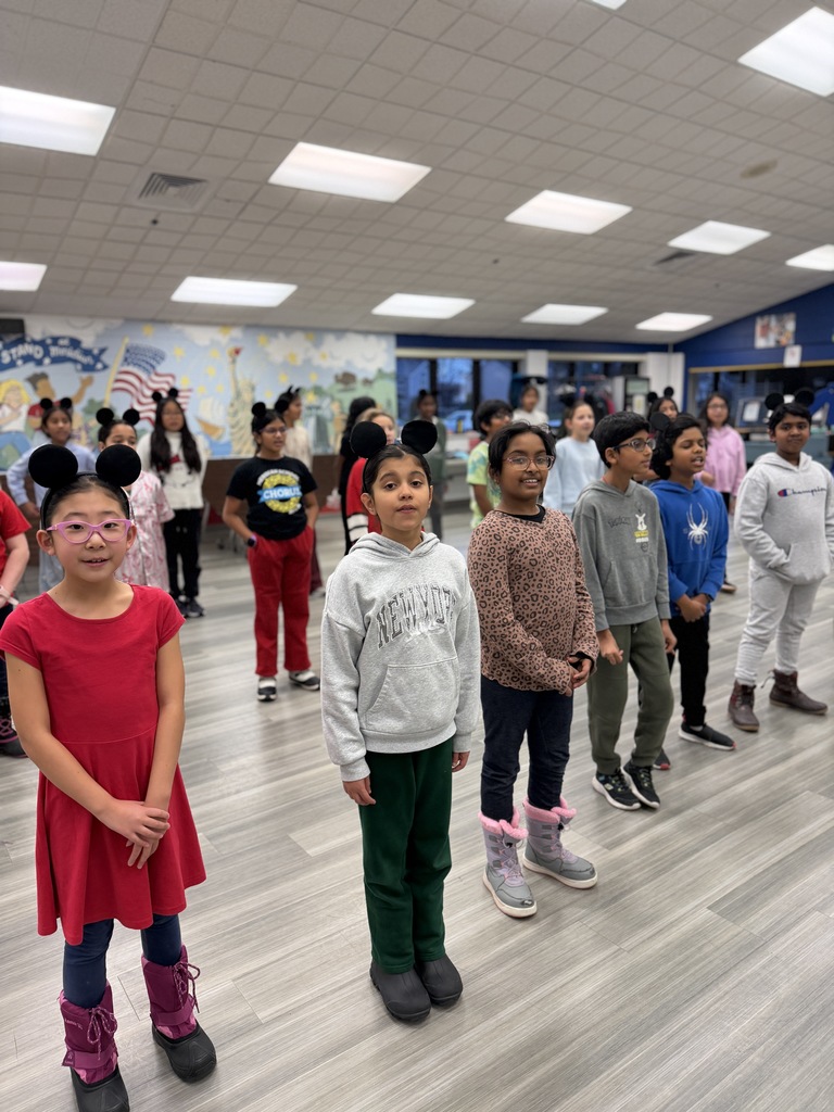 Students singing and preparing for a musical.