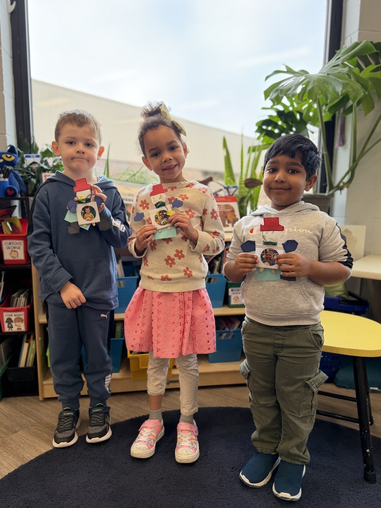 Students holding up their craft.