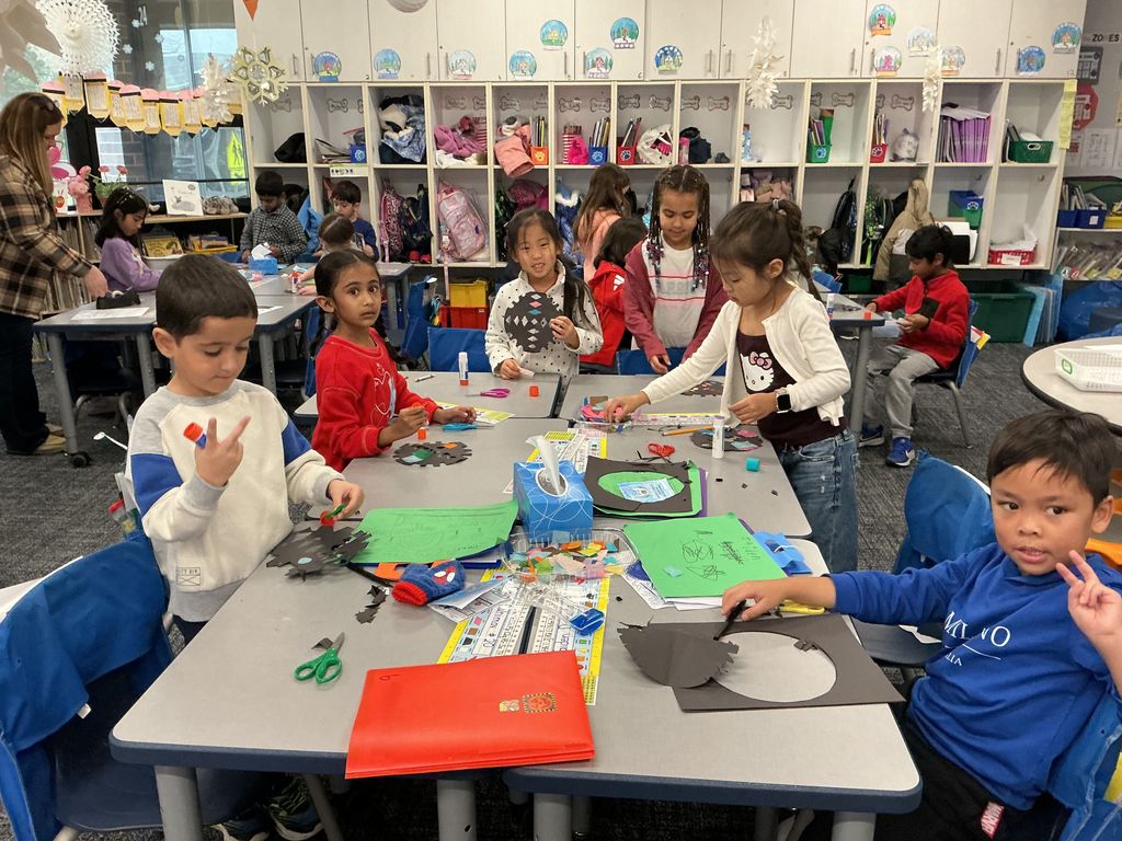 Students holding up their craft.