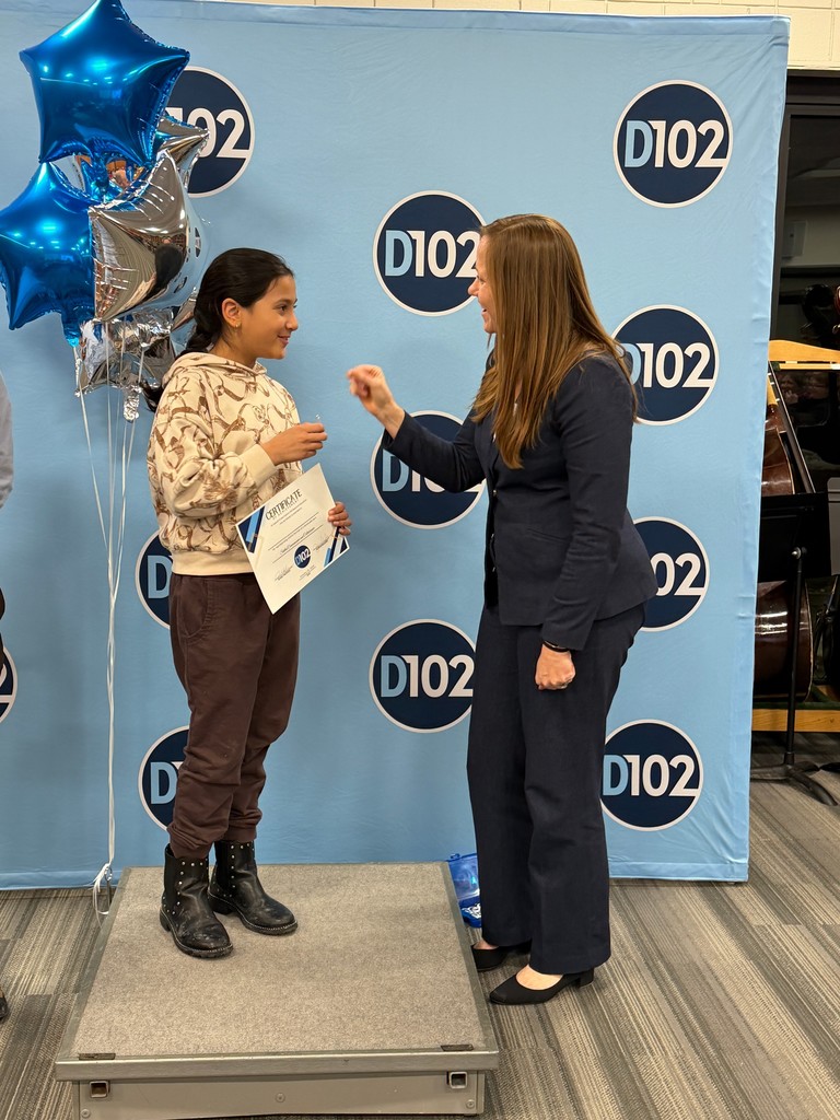 Dr. McIntyre giving a keychain.