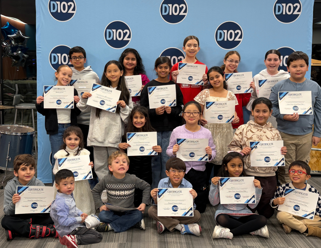 Students holding their certificates. 