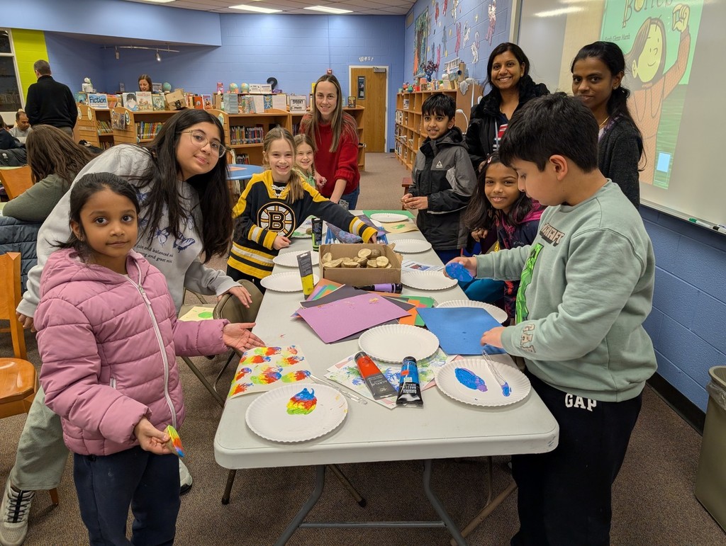 families standing together at a table.