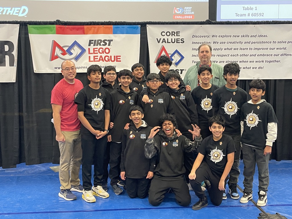 Robotics team standing together.