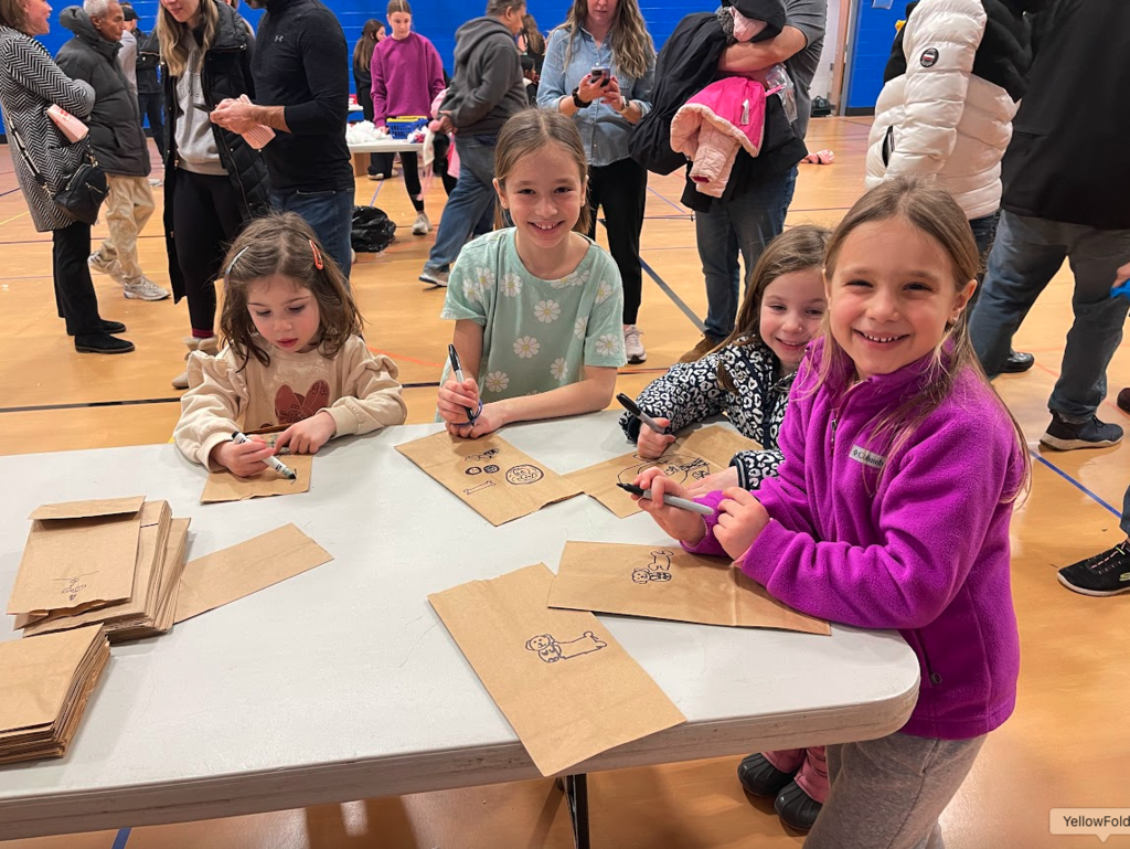 Students coloring bags.