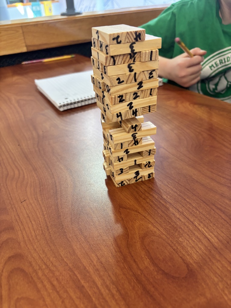 Photo of the Jenga game with numbers on it.