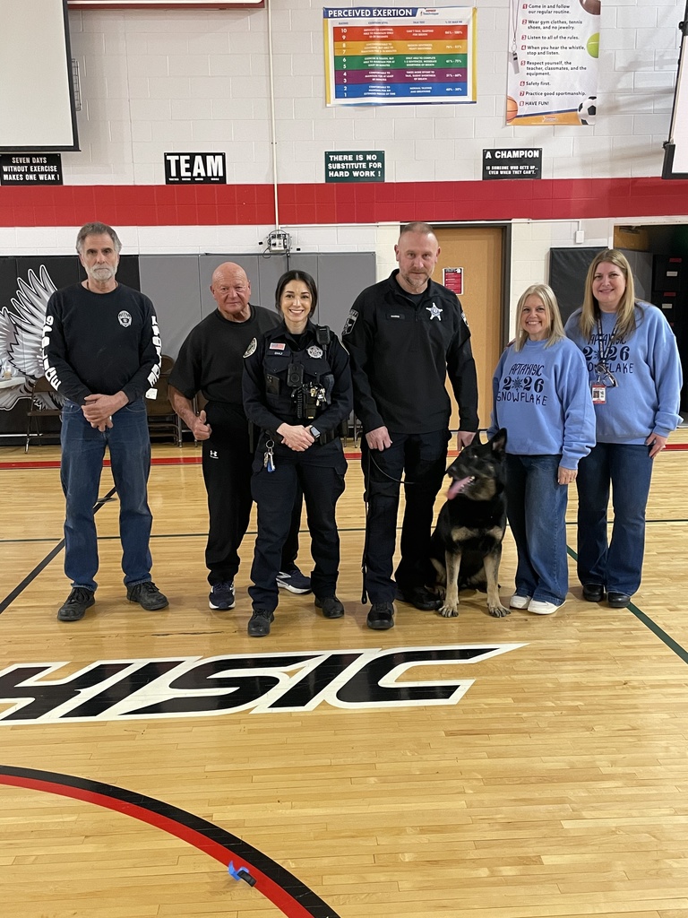 Snowflake event volunteers including a dog and police officers.