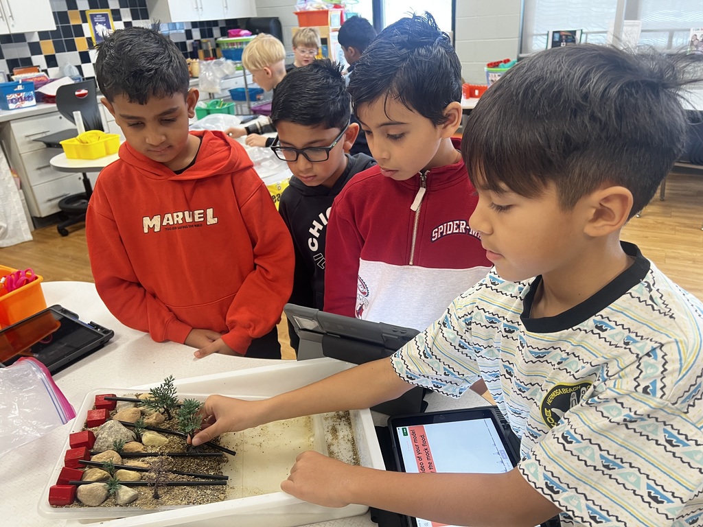 Students working in a group creating the erosion barrier.