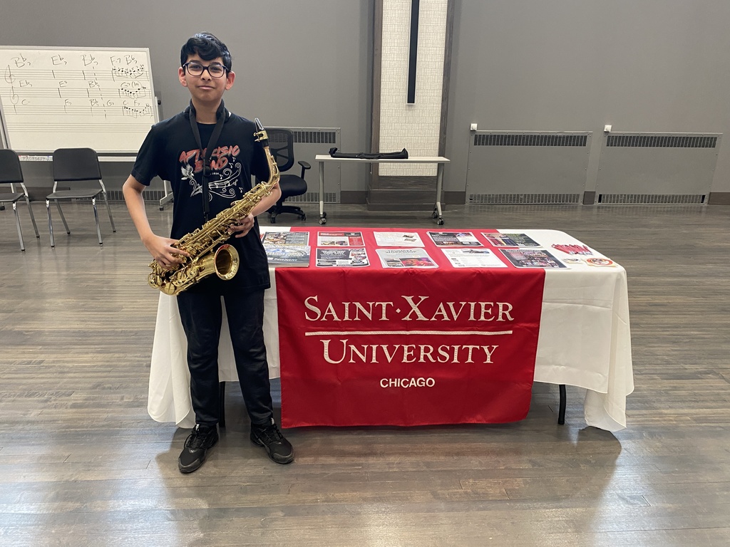 Student holding a sax.