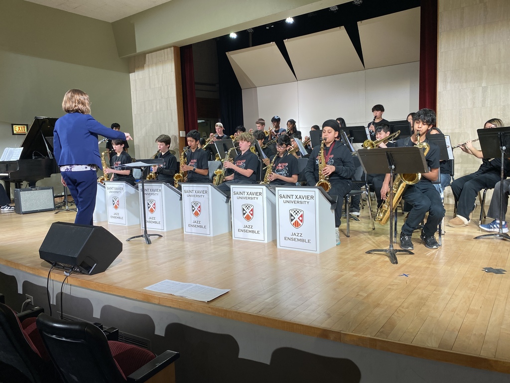 Students performing on stage.
