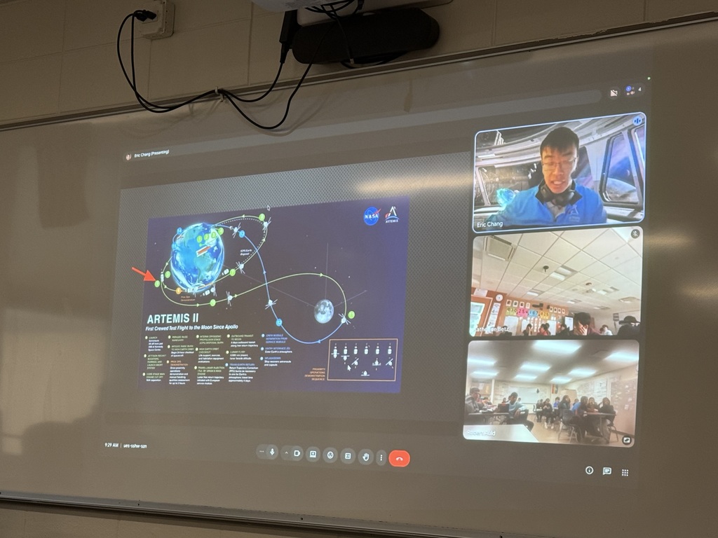 Photo of a projected zoom call of a rocket scientist who was working on Artimus II.