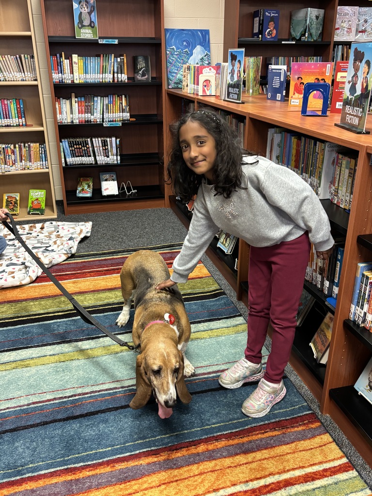 Student petting a therapy dog.
