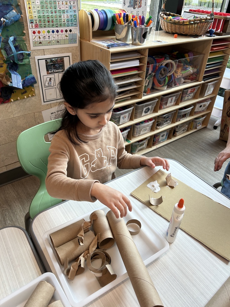 STudent creating recycled art.