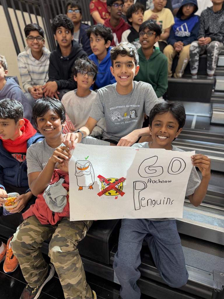 Students holding up a sign.