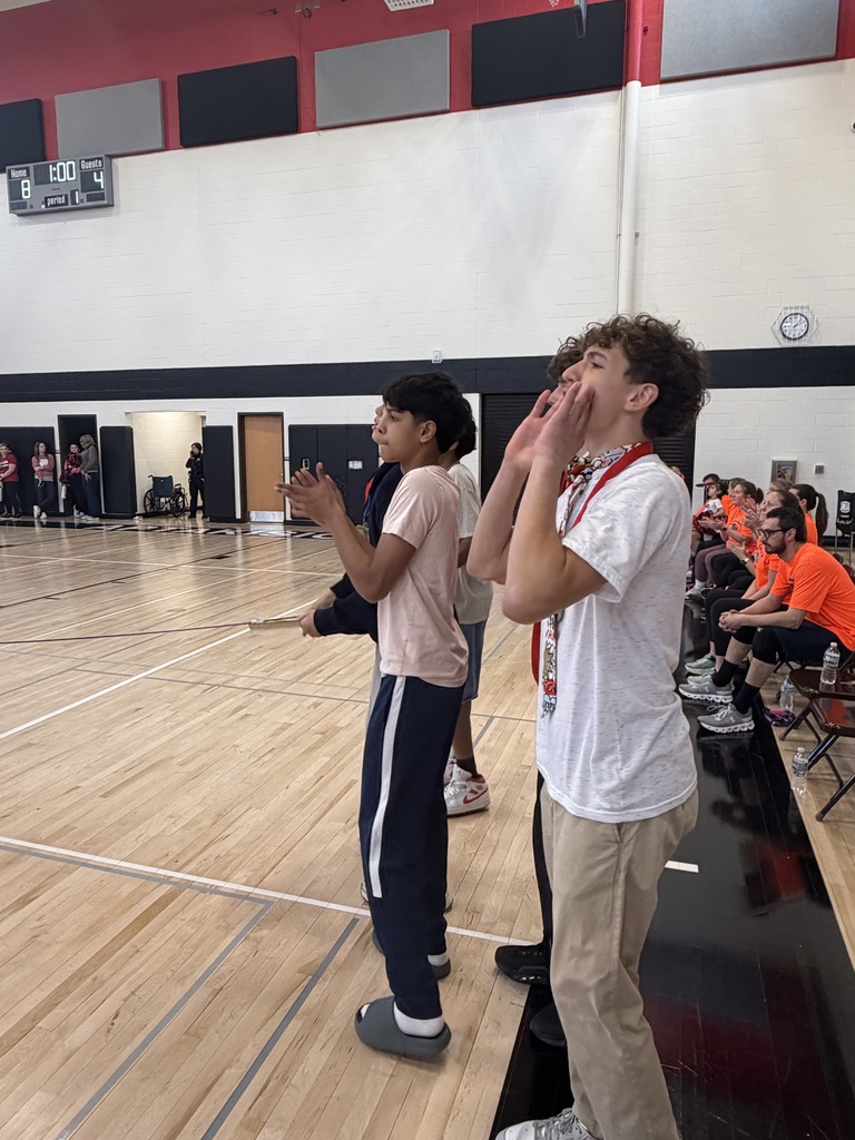 Student coaches cheering for their team.