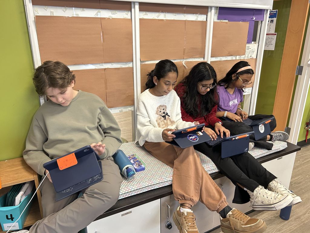 Students working intently at a bench.