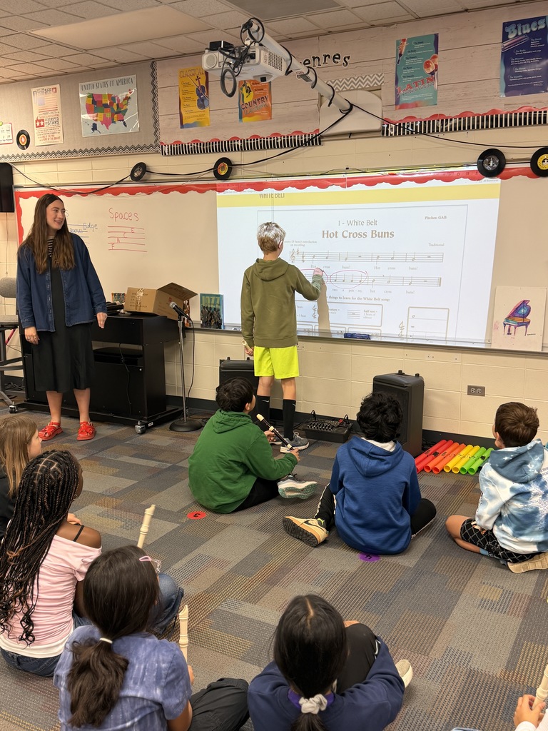 Students identifying patters in notes and circling on the board.