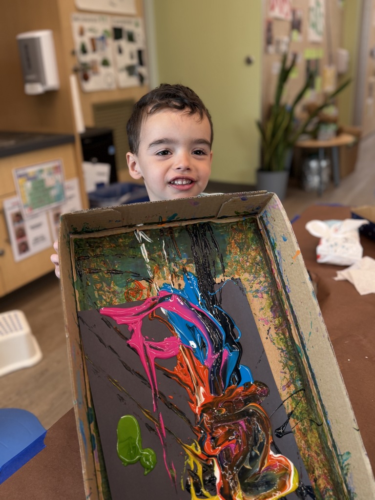 Boy showins his marble art.