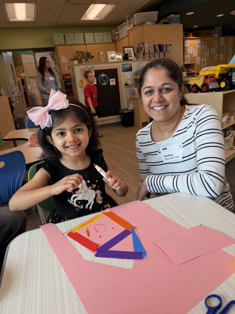 Mother and daughter sitting with a craft project.