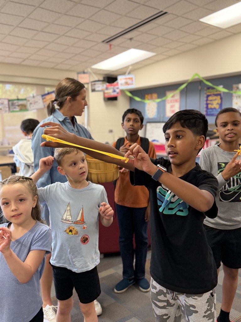 Student playing a sling shot game.