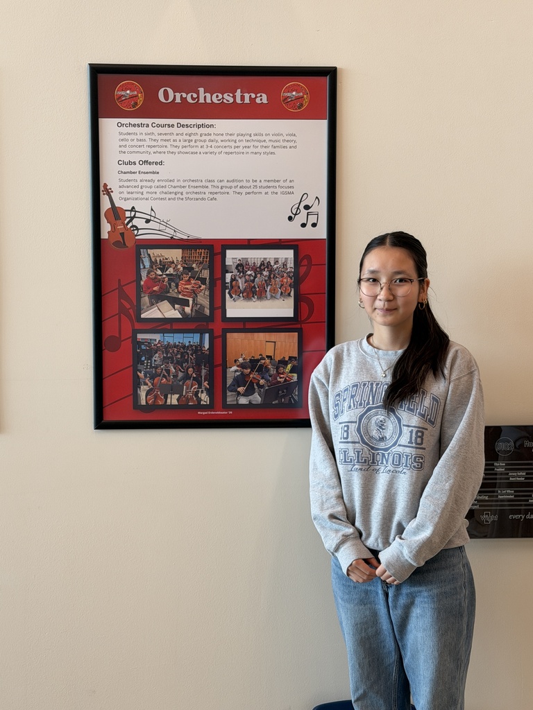 1 student standing by their poster.
