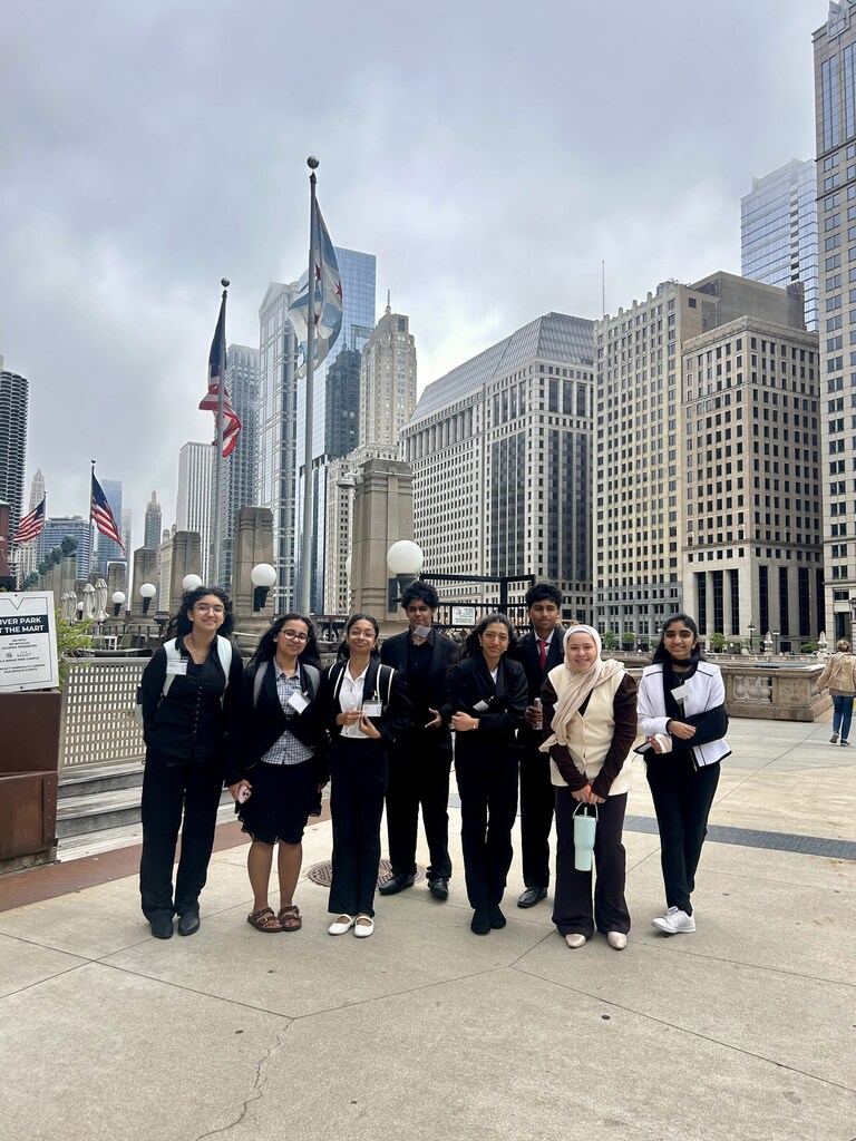 Students standing in a group in the city.