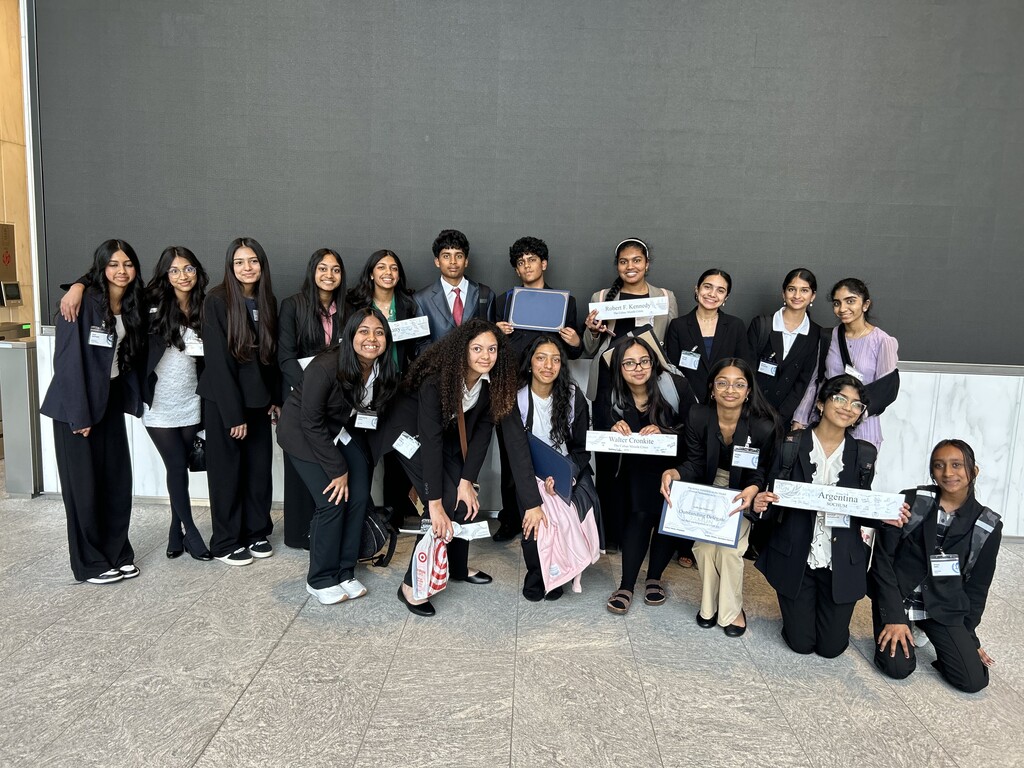 Students standing with certificates.