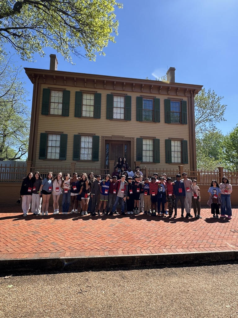 Students standing in front of Lincoln's house. 