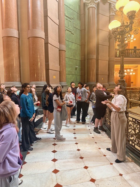 Students listening to tour guide.