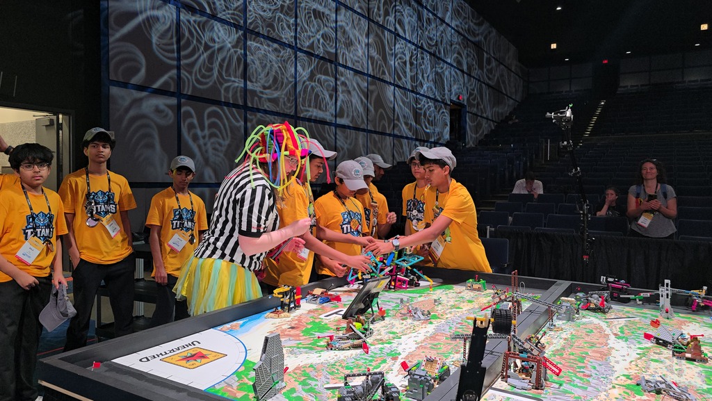 Students competing at a table.
