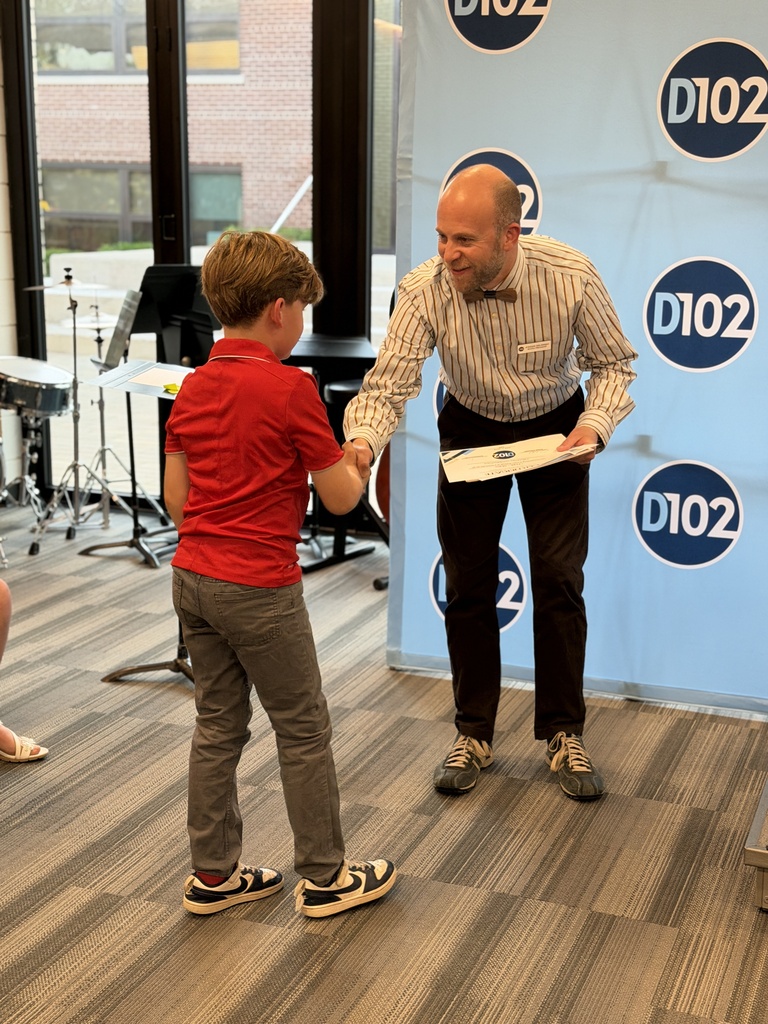 Mr. Sklansky shaking hands with a student. 
