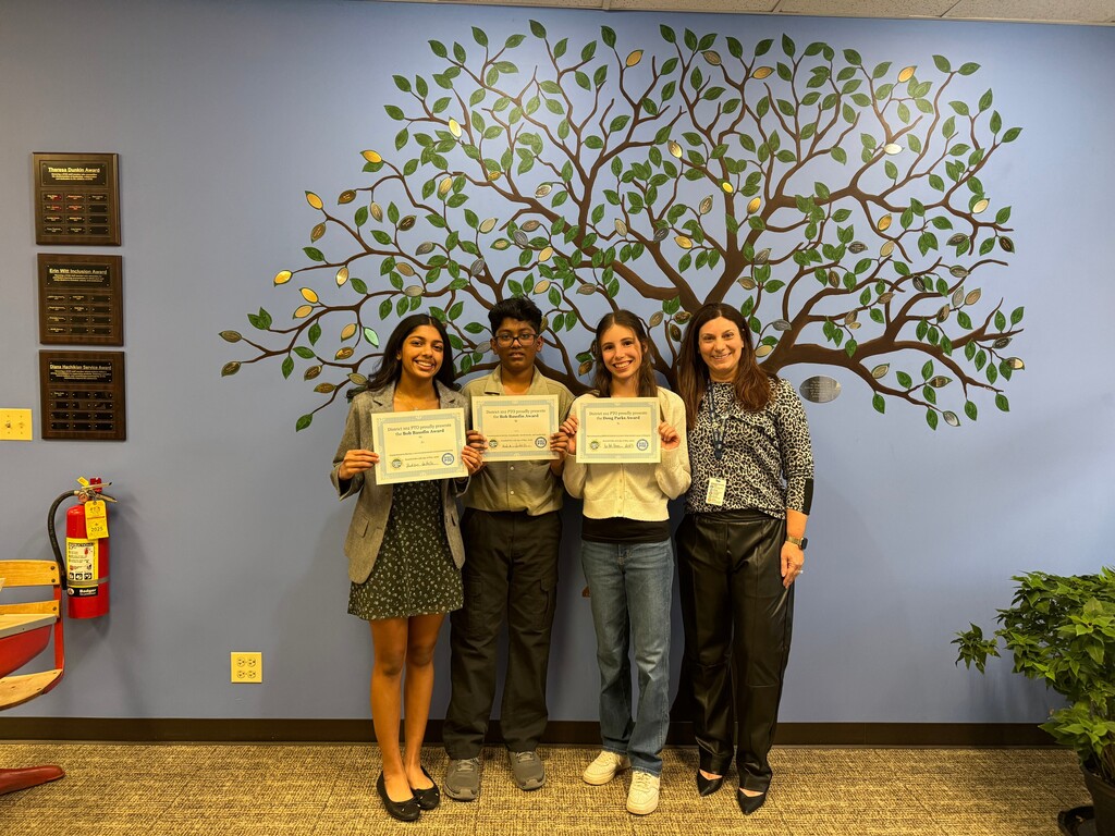 3 students standing with Mrs. Tamez.