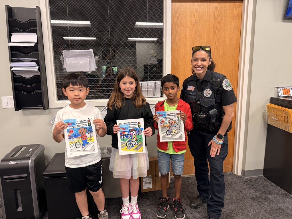 Students standing with Officer Diaz.