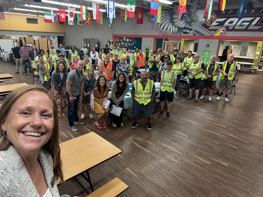 Dr. McIntyre taking a selfie with all of the admin and bus drivers. 