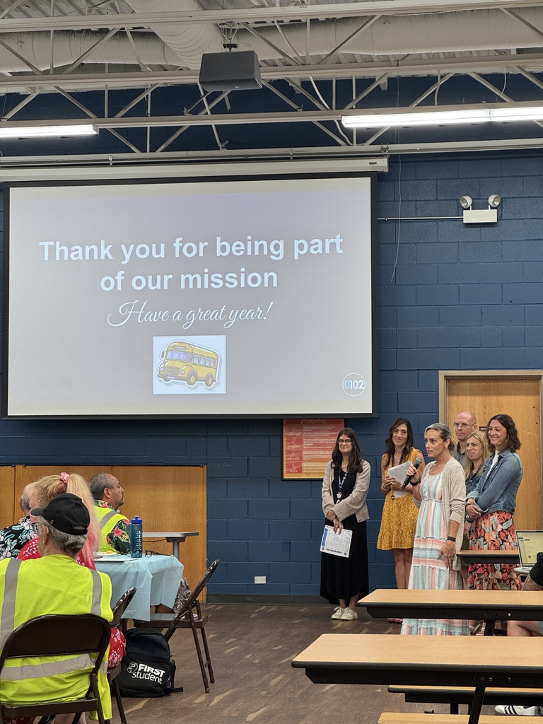 Principals giving a presentation to drivers about bus safety. 