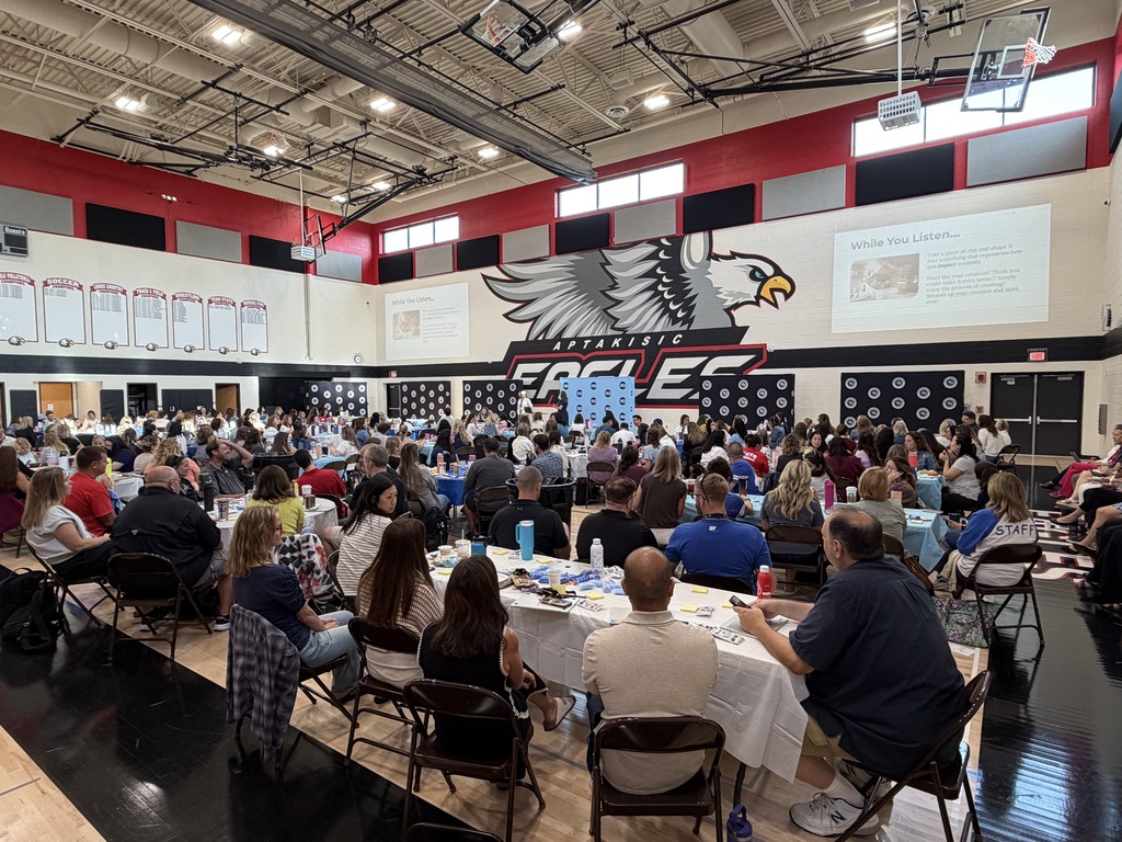 Entire staff sitting and listening to Dr. McIntyre