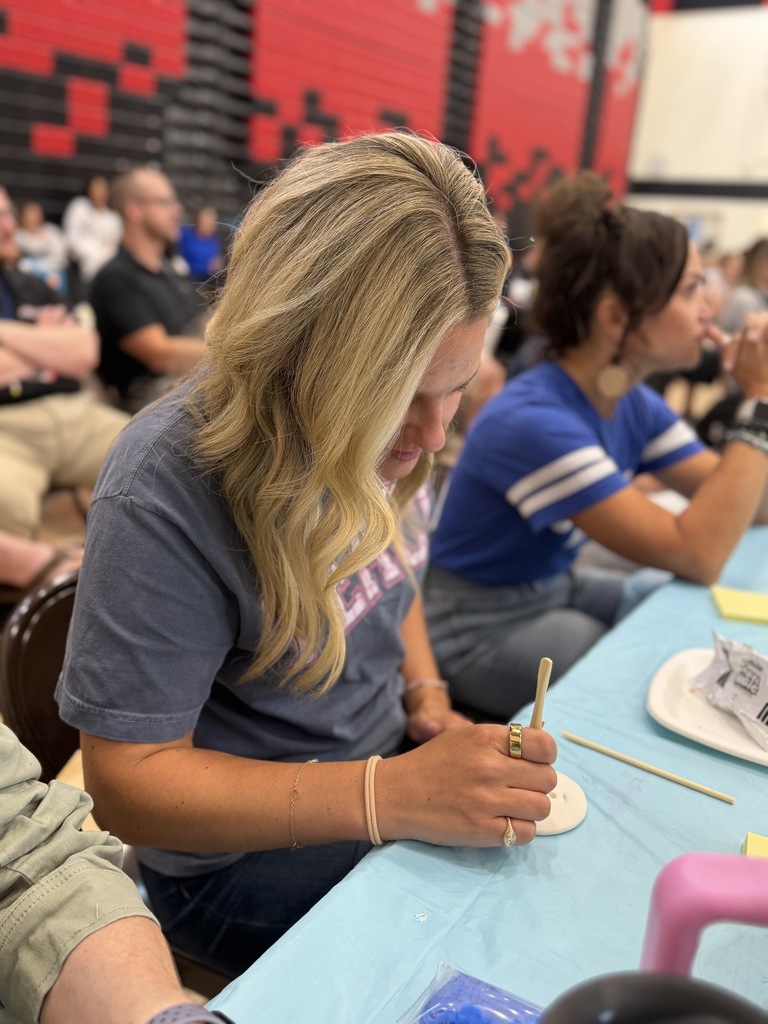 Teacher working on her clay creation.