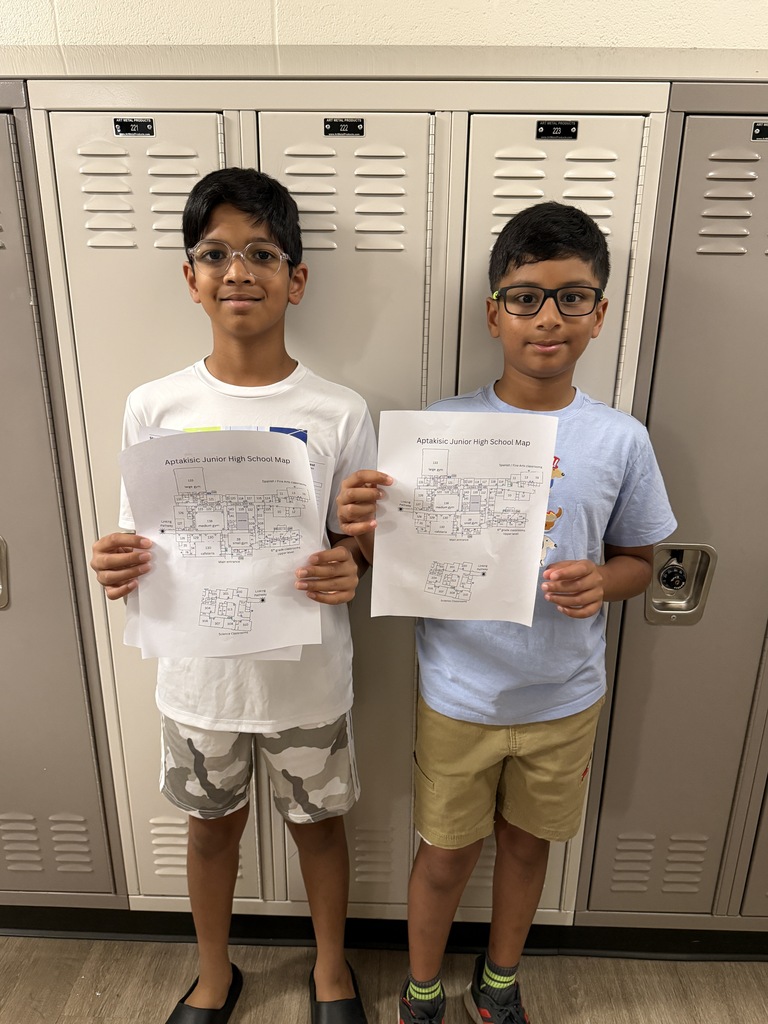 2 boys holding a map of AJHS.