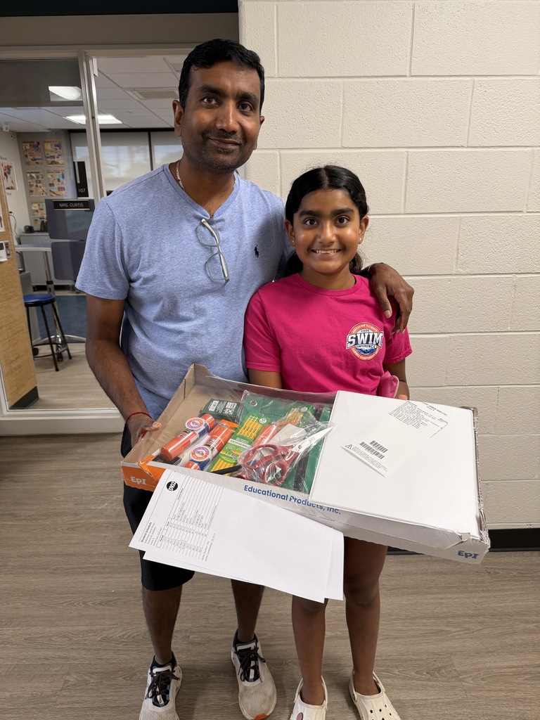 Father and daughter at school with her supplies.