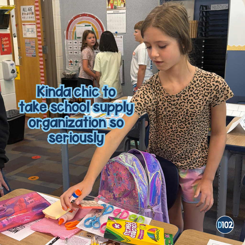 PIc of a girl organizing school supplies.