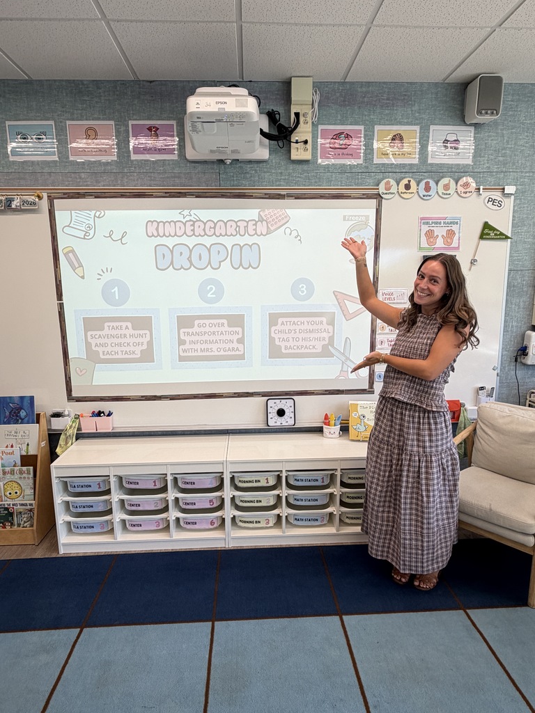 Student pointing at a screen. 